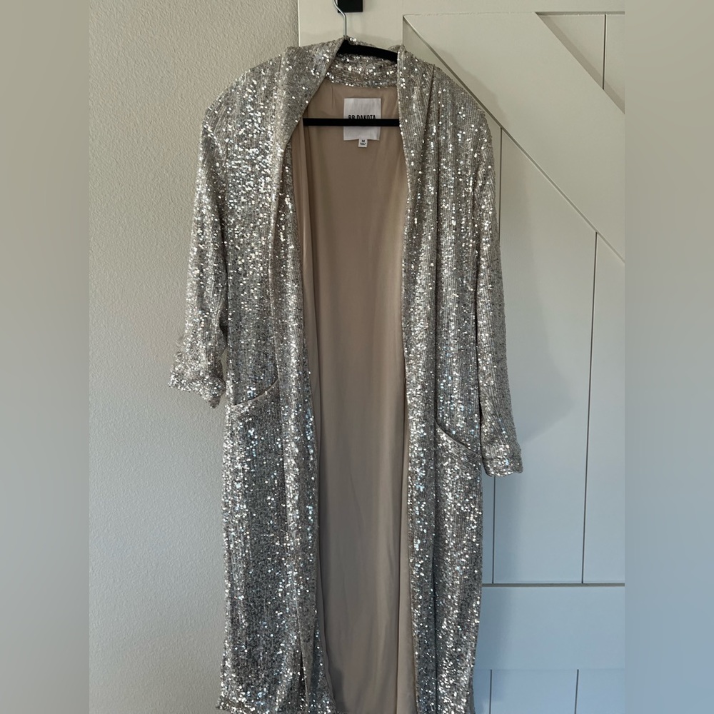 Show Stopper Duster by BB Dakota. Silver sequined, knee-length coat